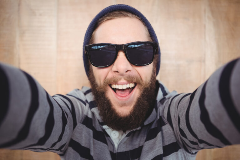 Happy hipster wearing sunglasses