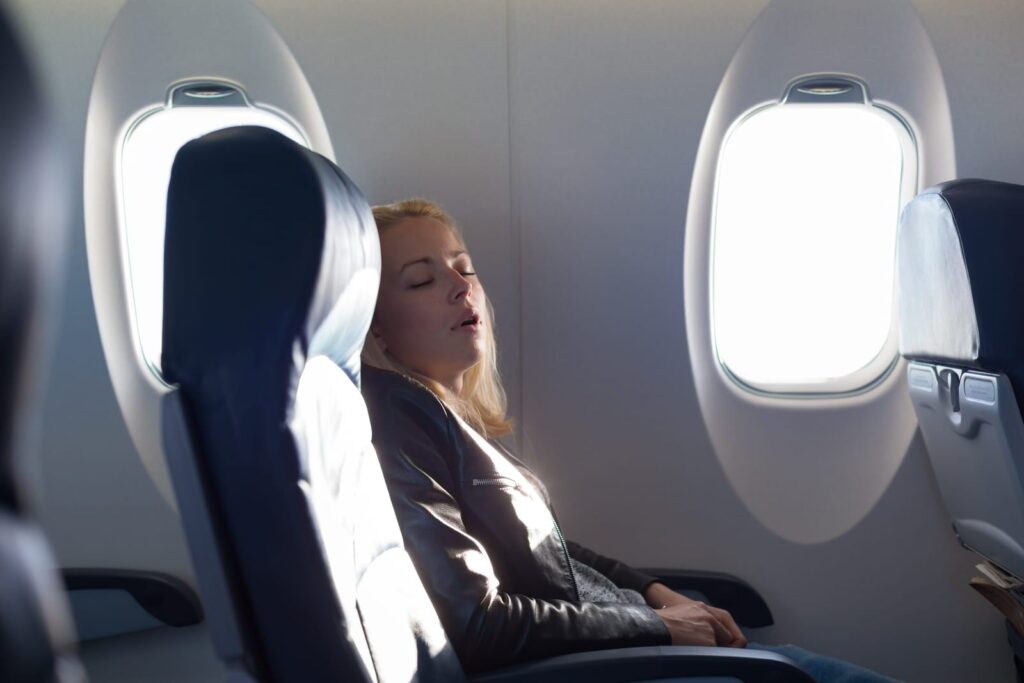 Lady napping on a plane